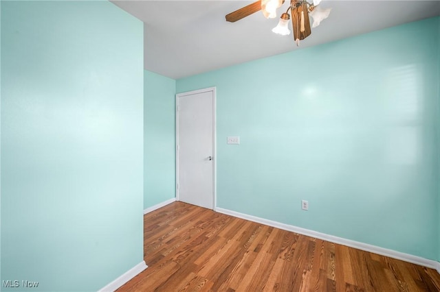 empty room featuring ceiling fan and light wood-type flooring