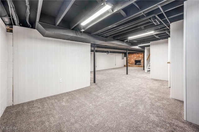 basement featuring carpet flooring