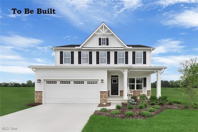 view of front of home featuring a porch, a garage, and a front yard