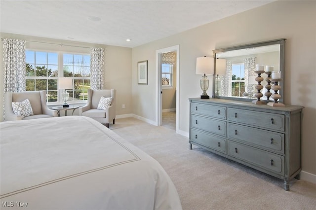 bedroom with light colored carpet