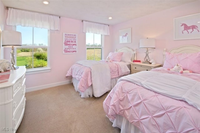 bedroom with light colored carpet