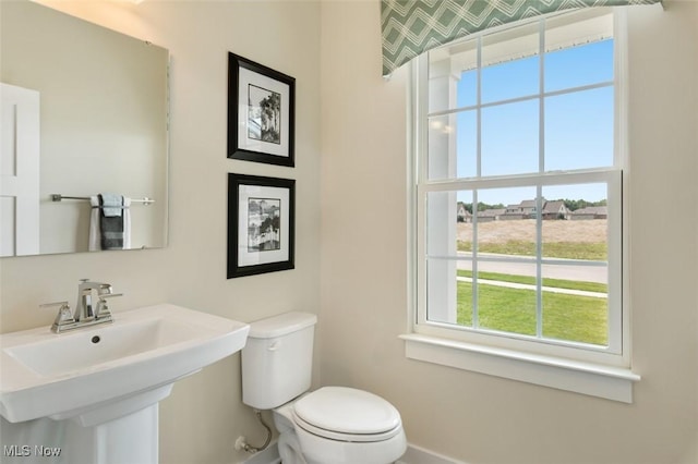 bathroom featuring sink and toilet