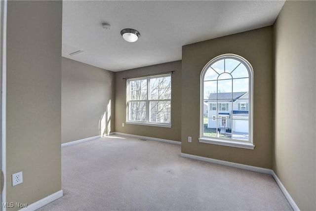 empty room with light colored carpet