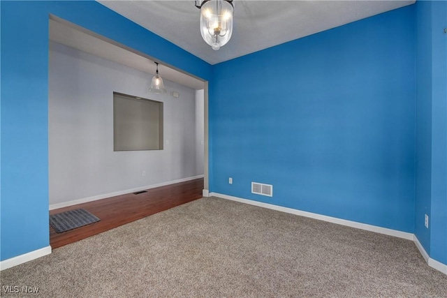 spare room with carpet floors