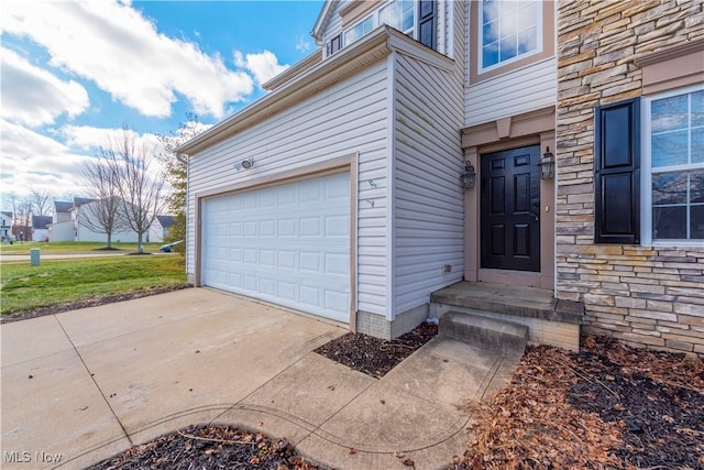 view of exterior entry with a garage