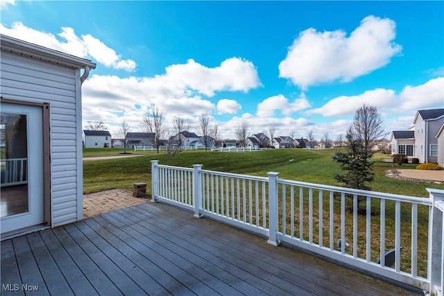 deck featuring a patio and a lawn