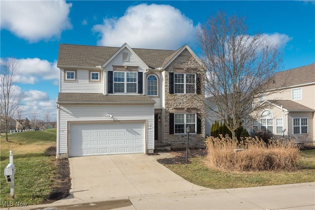 view of front facade with a garage and a front yard