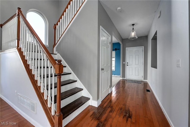 entrance foyer featuring dark hardwood / wood-style flooring