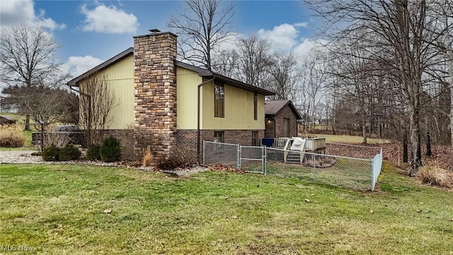 view of property exterior featuring a lawn