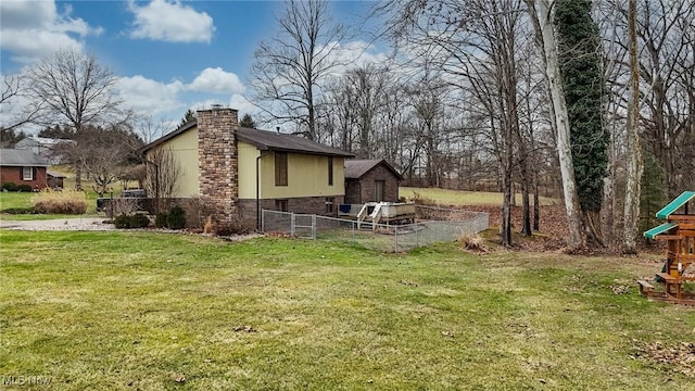 view of property exterior with a playground and a lawn