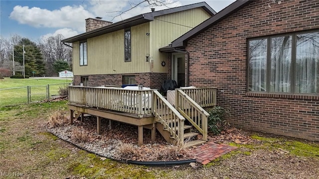 exterior space with a yard and a deck