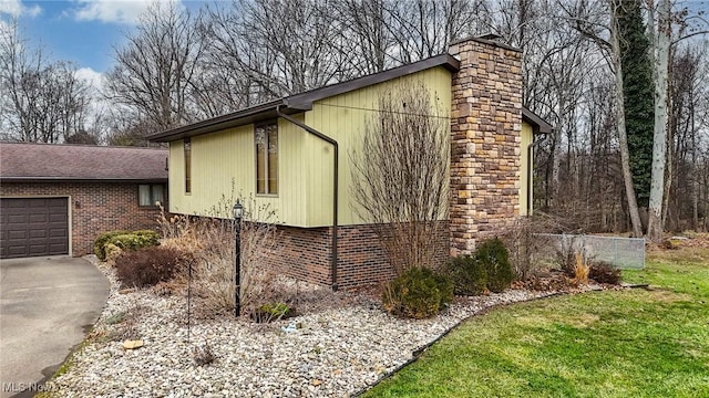 view of side of home featuring a garage