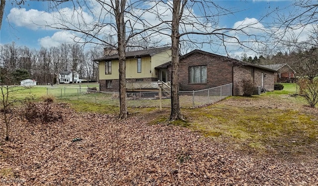 view of side of property with a yard