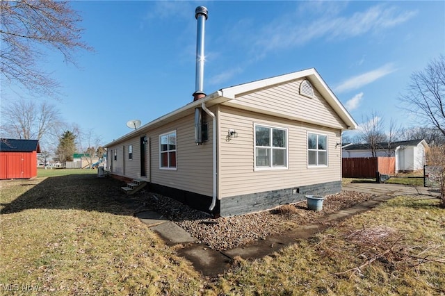 view of property exterior featuring a lawn