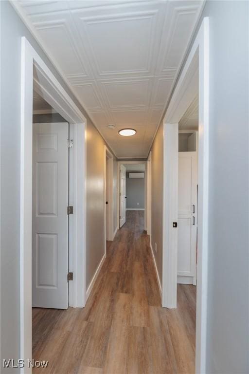 hallway with light wood-type flooring