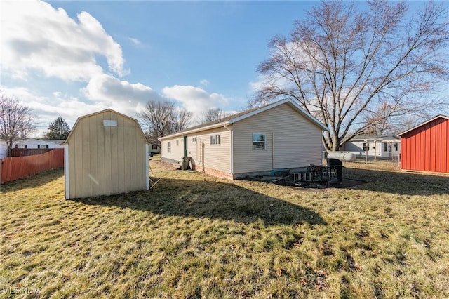 exterior space with a shed and a lawn