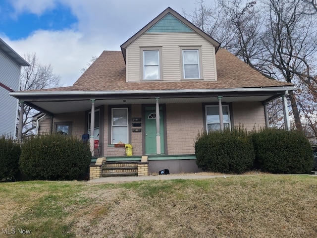 view of front of property with a front lawn and a porch