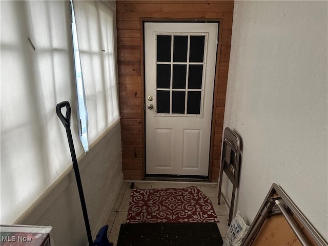 entryway with light tile patterned flooring