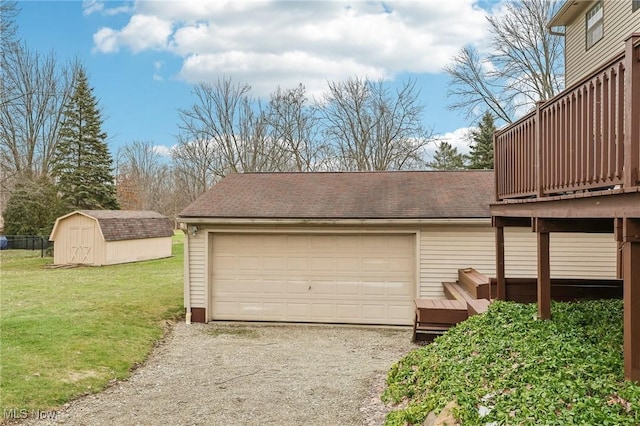 garage featuring a lawn