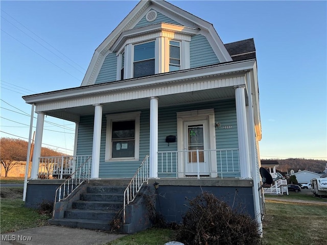 view of front of property featuring covered porch