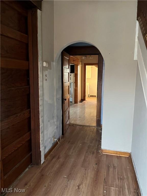 corridor featuring dark hardwood / wood-style floors