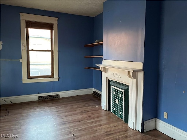 unfurnished living room with wood-type flooring