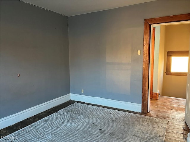 empty room with wood-type flooring