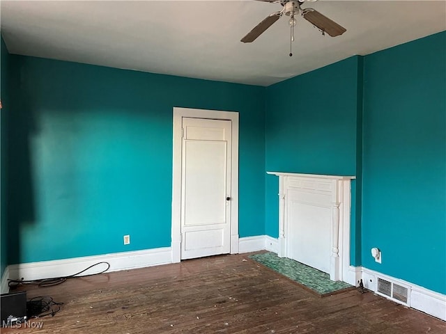 empty room featuring hardwood / wood-style flooring and ceiling fan