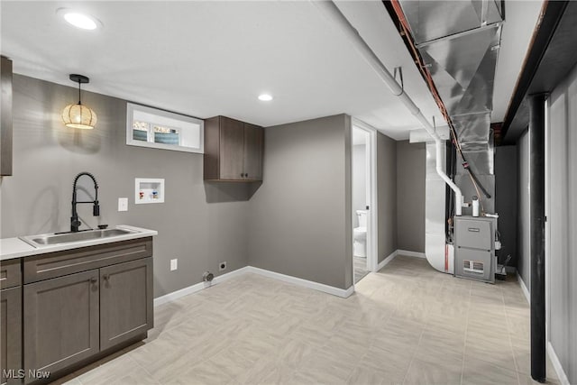 laundry room with gas dryer hookup, sink, cabinets, washer hookup, and hookup for an electric dryer