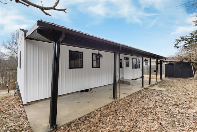 view of side of property featuring a patio area