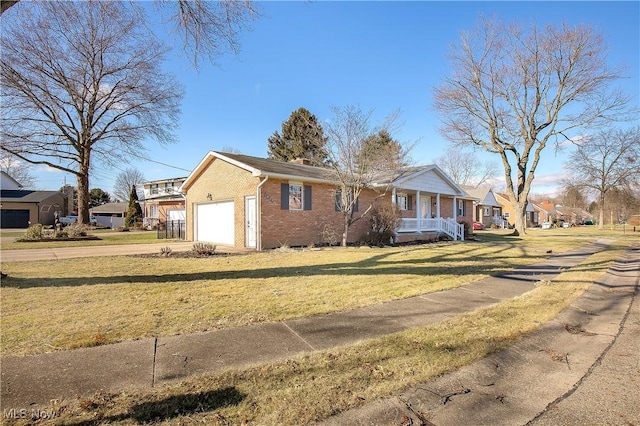 view of front of property featuring a garage and a front lawn