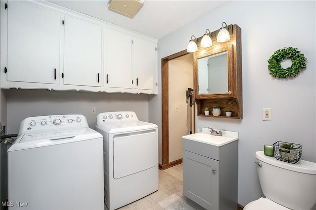 clothes washing area with sink and washer and clothes dryer