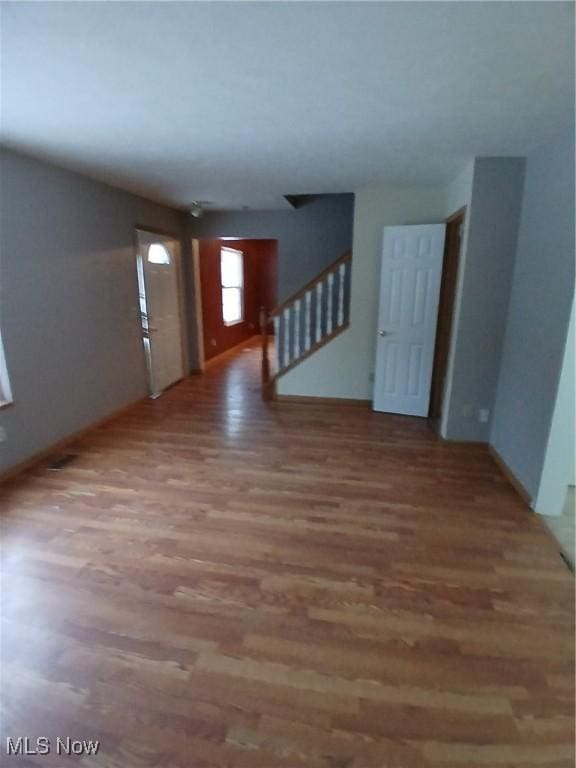 unfurnished room featuring wood-type flooring