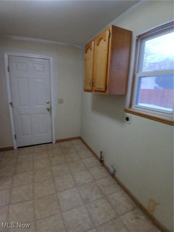 washroom with cabinets and hookup for an electric dryer