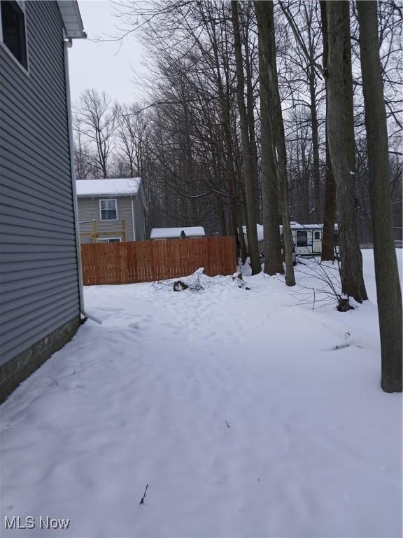 view of yard layered in snow