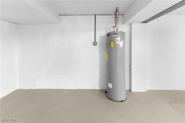 utility room featuring water heater