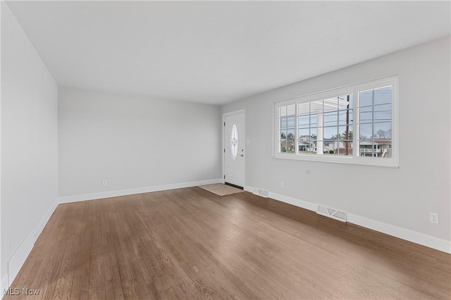 spare room featuring hardwood / wood-style flooring