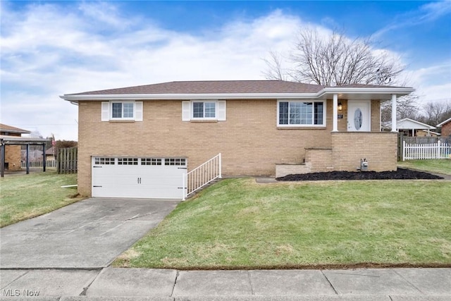 view of front of house featuring a garage and a front lawn