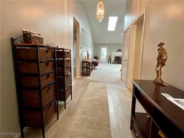 721 Winding Way, Akron, OH 44313 - corridor featuring lofted ceiling, light wood finished floors, and a skylight