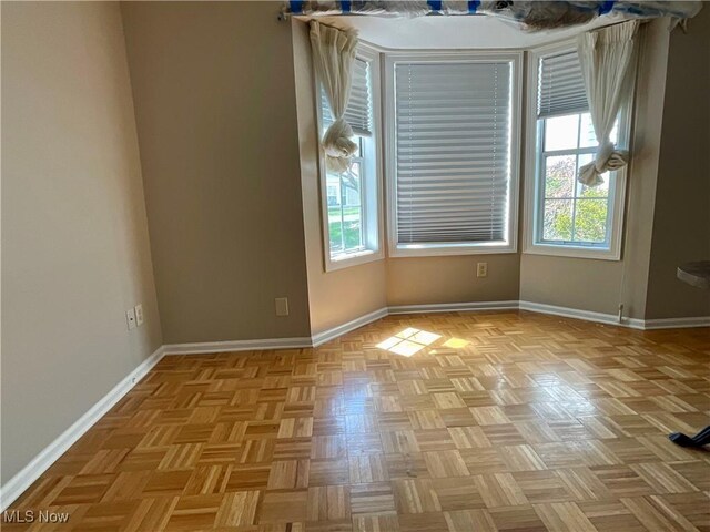 721 Winding Way, Akron, OH 44313 - spare room featuring healthy amount of natural light and baseboards