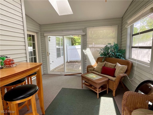 721 Winding Way, Akron, OH 44313 - sunroom / solarium featuring vaulted ceiling, a skylight, healthy amount of natural light, carpet flooring, and wood walls