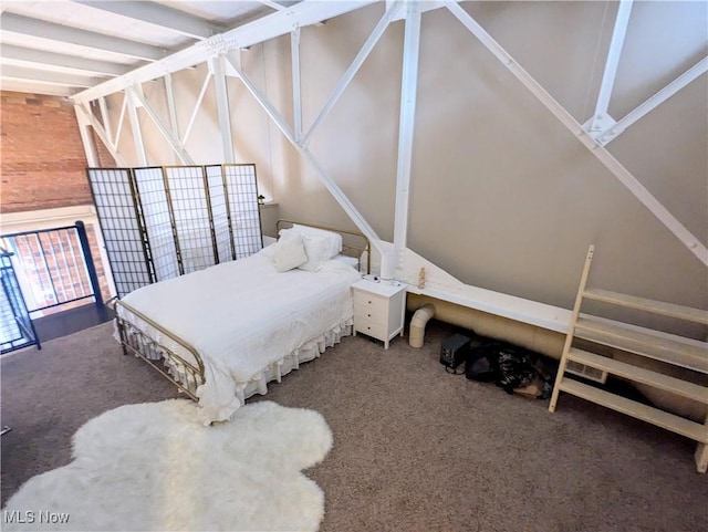 bedroom with carpet flooring and vaulted ceiling