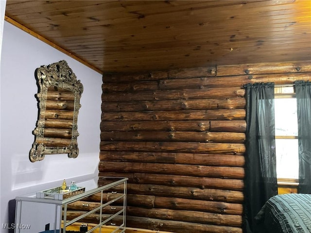 room details featuring log walls and wood ceiling