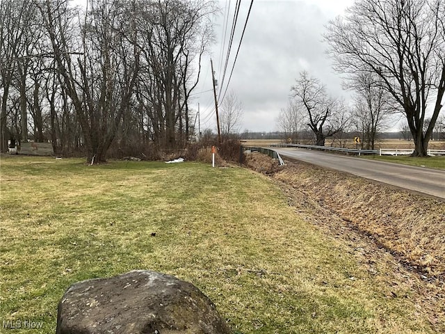 view of yard with a rural view