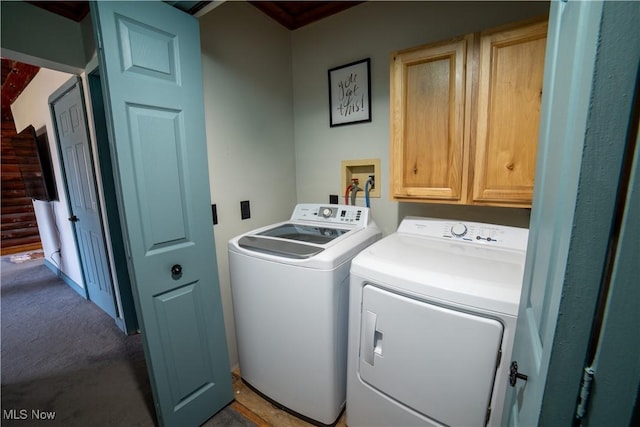 clothes washing area with cabinet space and washer and clothes dryer