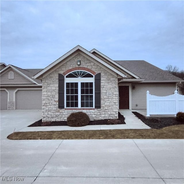 single story home with a garage