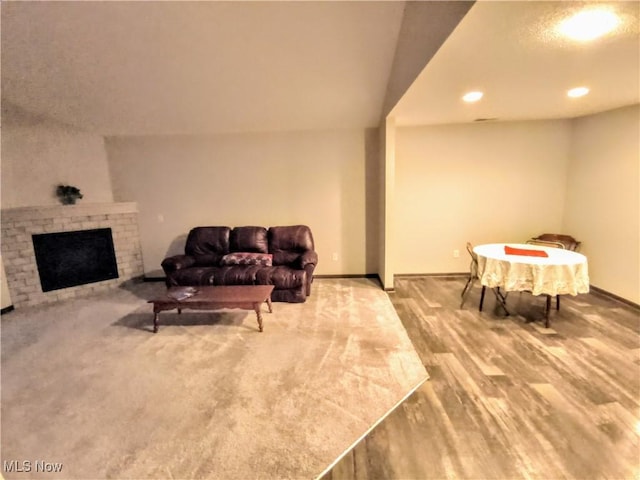 living room featuring a fireplace and hardwood / wood-style floors