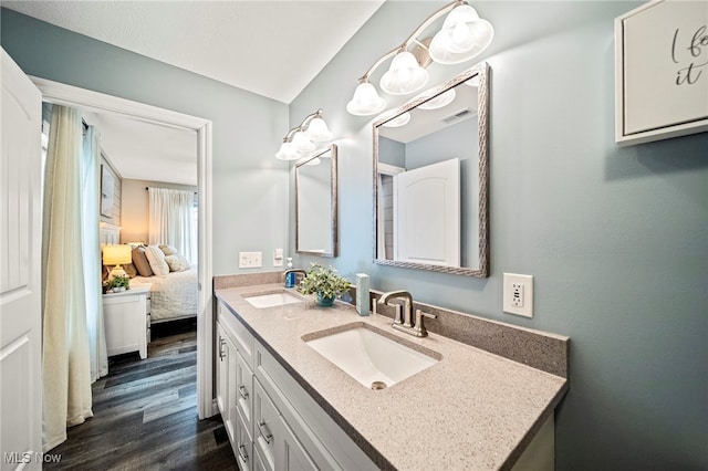 bathroom with vanity and hardwood / wood-style floors