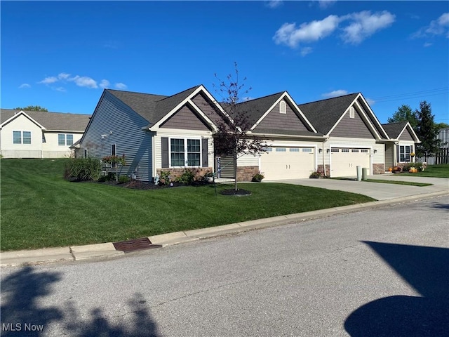 view of front of house with a garage and a front lawn