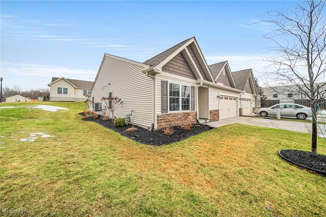 view of side of property with a yard, central AC unit, and a garage